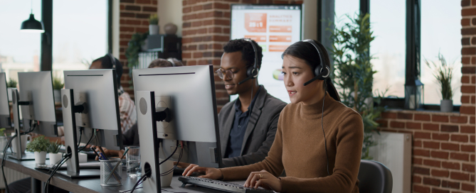 Multiethnic team of people working at call center office